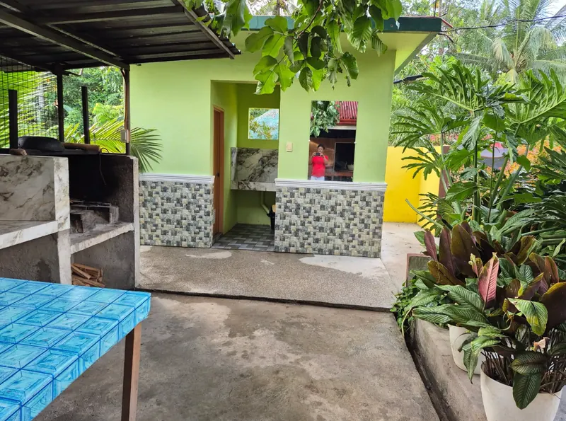Outdoor kitchen with griller and wash area